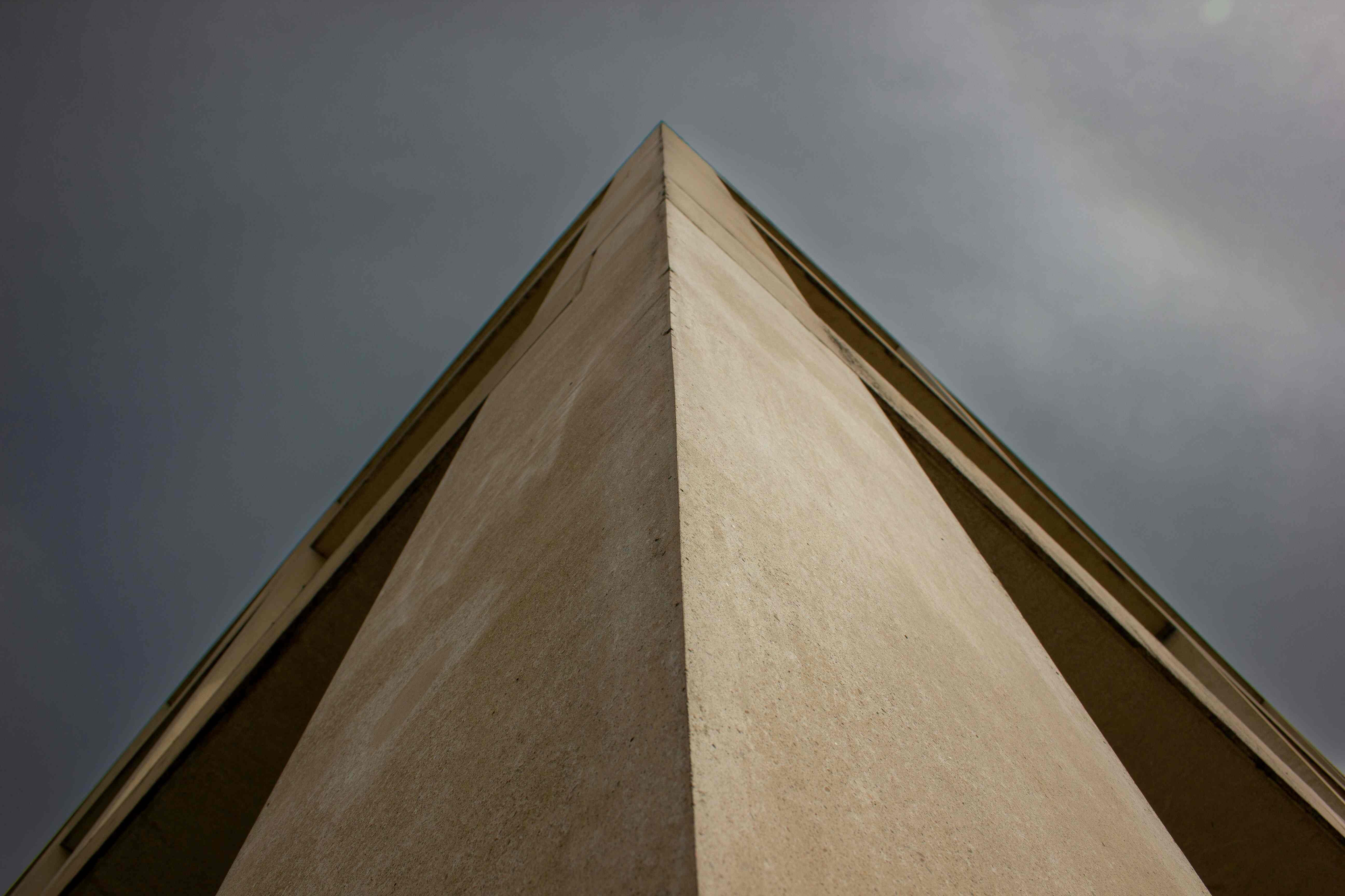 a tall building with a sky in the background